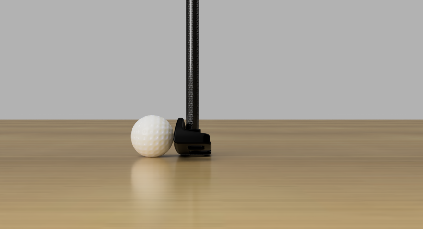The putter addressed to a golf ball on a hardwood floor